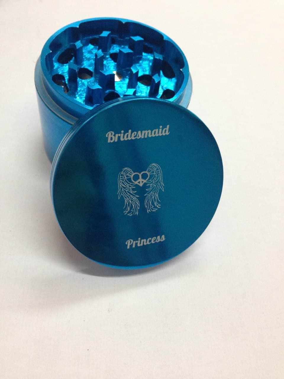 Custom bridesmaid grinder engraved with winged hearts