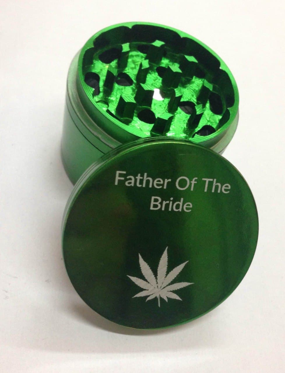 Custom grinder engraved for the Father of the Bride with a cannabis leaf