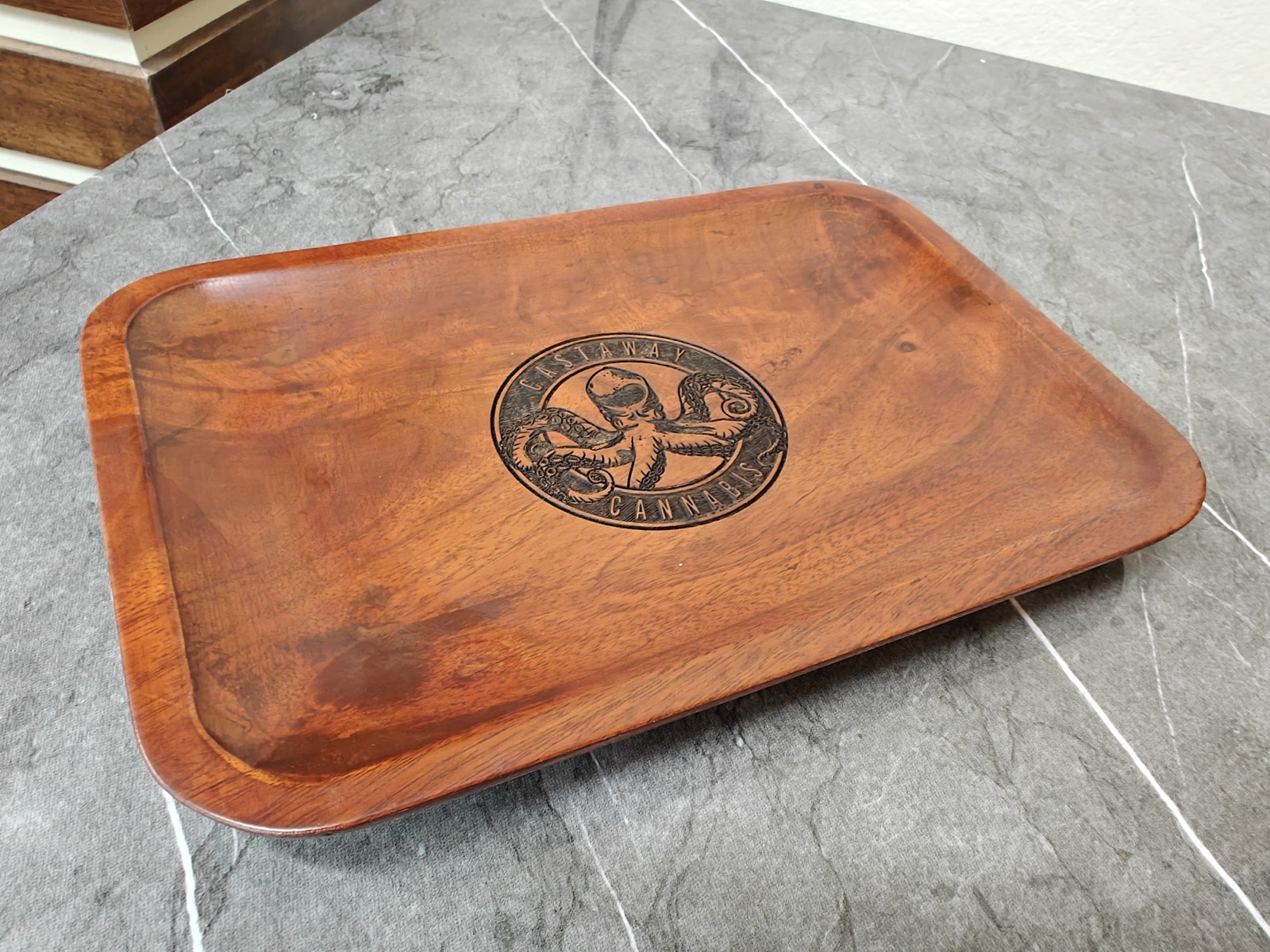 Custom branded wooden rolling tray with laser-engraved logo